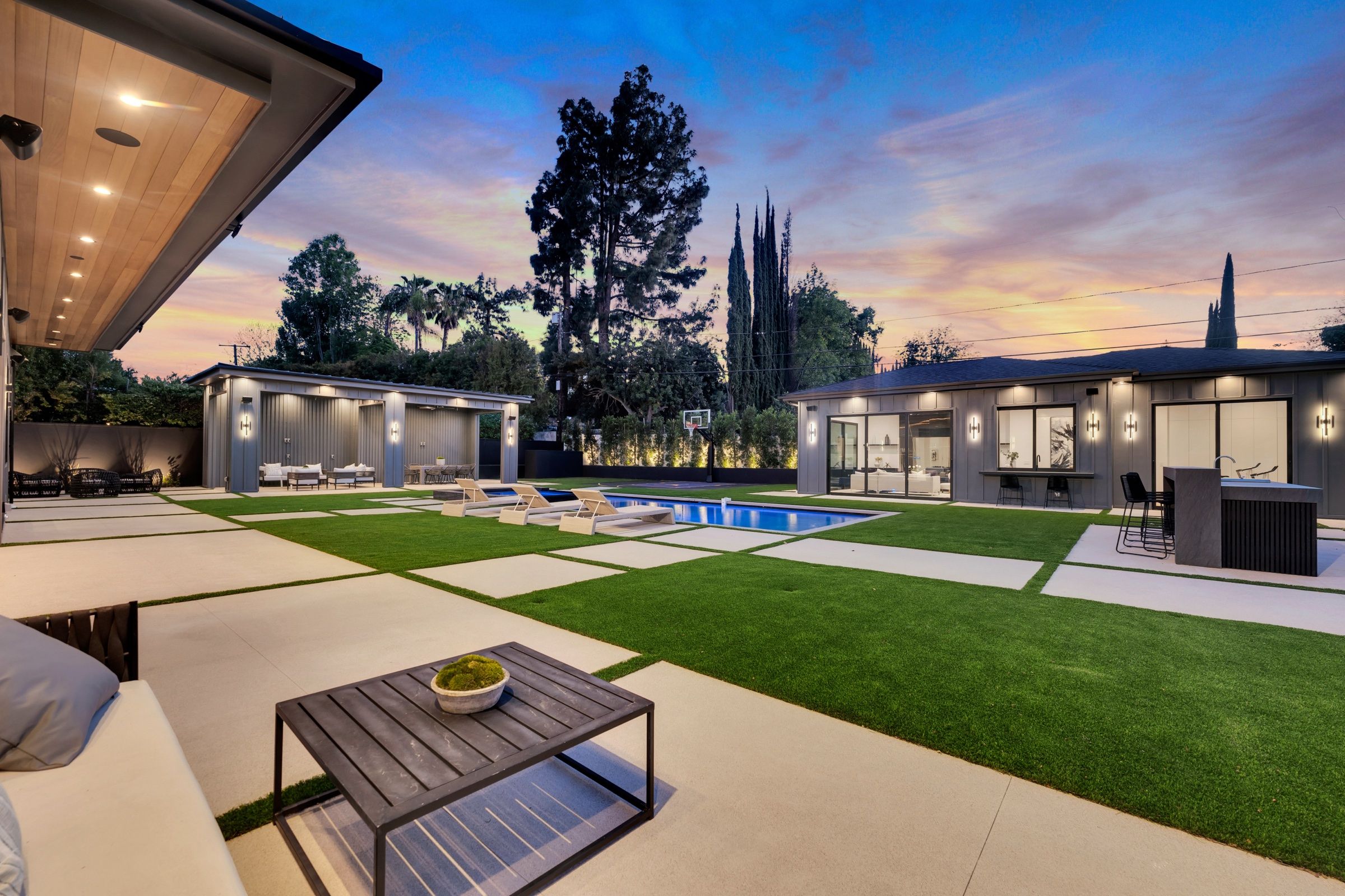 The garden terrace at dusk with lounge chairs