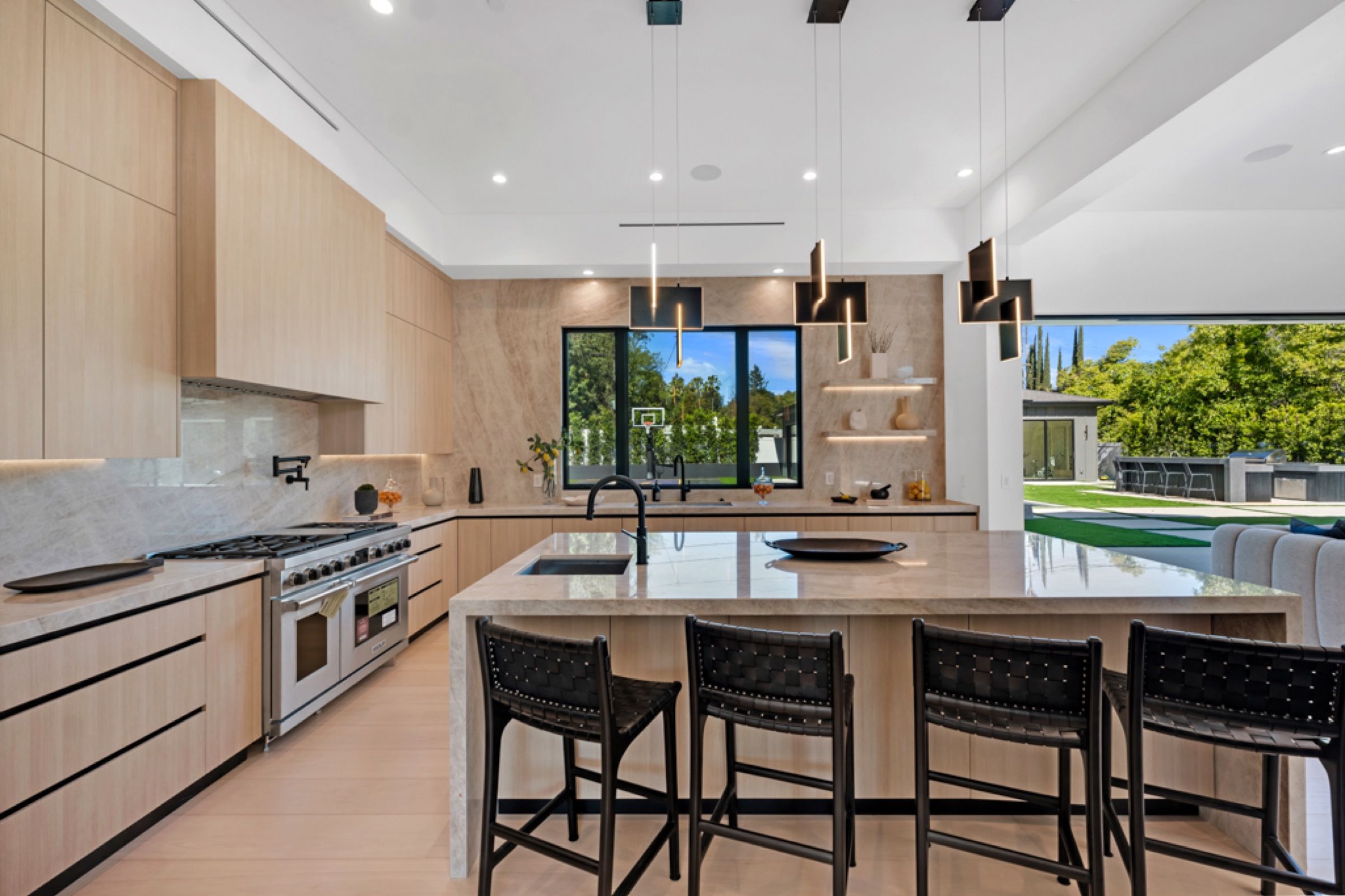 The kitchen island with seating and pendant lights