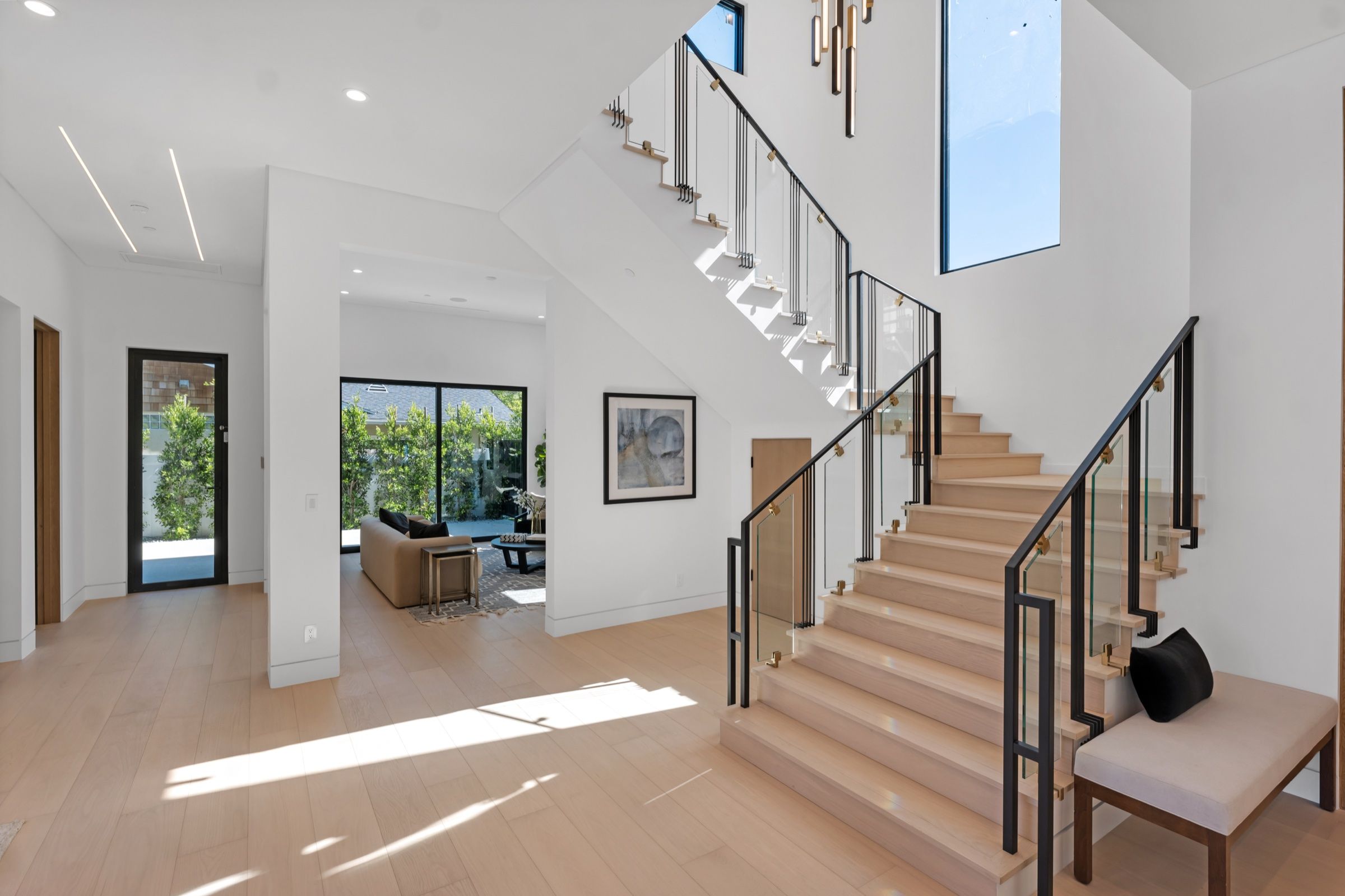 The staircase with glass rail and oak treads
